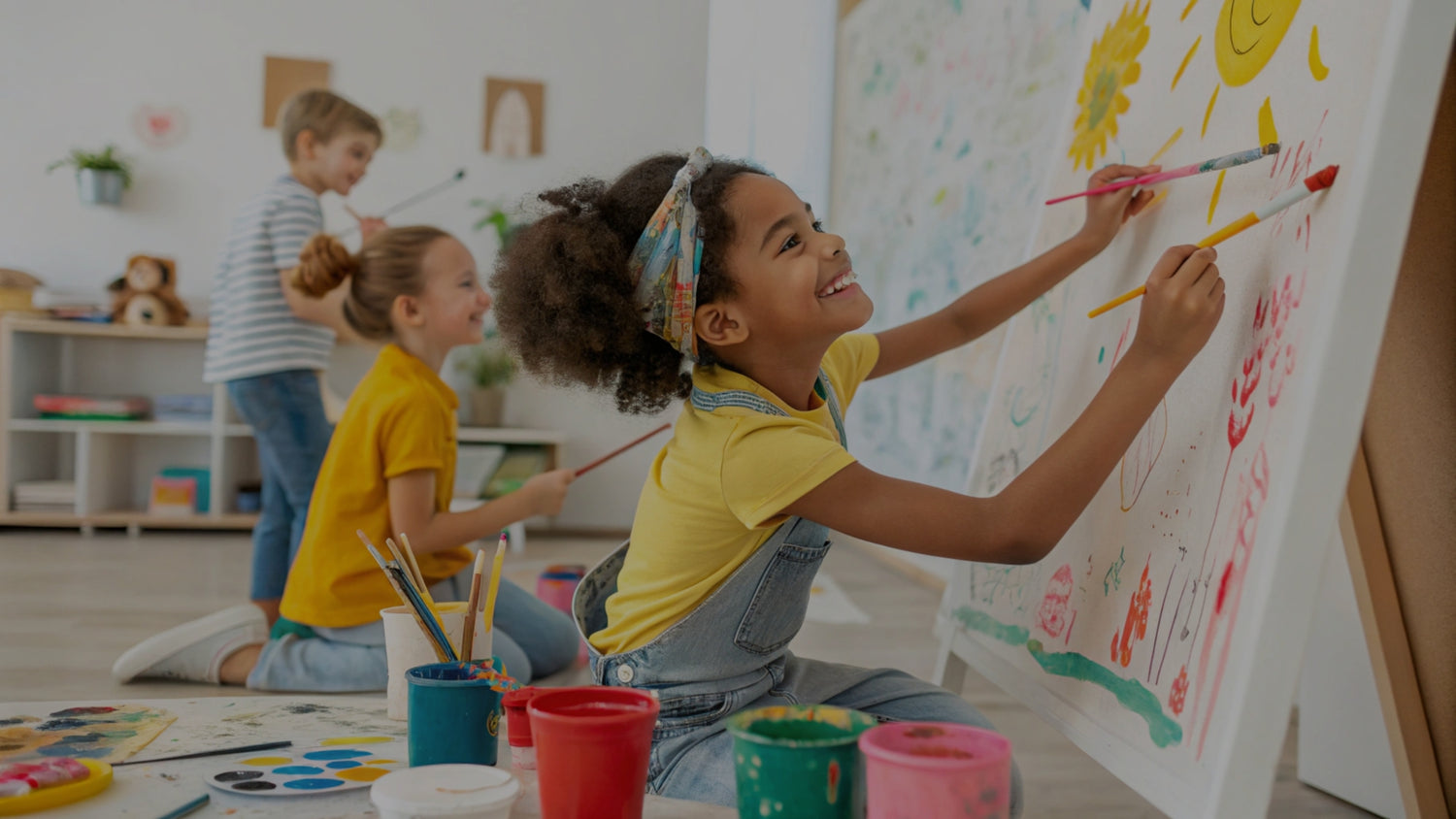 Children painting on a large canvas in a classroom setting